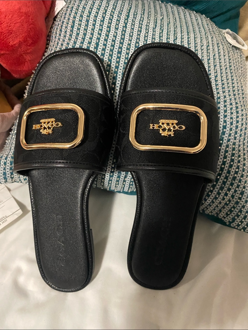 Coach Black Slide Mules with Gold Logo Plaque